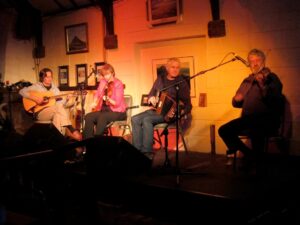 Picture of The Tune Makers; Dave Flynn, Liz Carroll, Máirtín O'Connor and special guest Tommy Peoples. Taken in Dunlewey Lakeside Centre, Donegal, 2012 